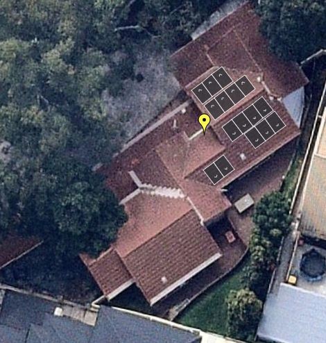 Overhead photo of solar panels on multiple roof spaces and shading. 
